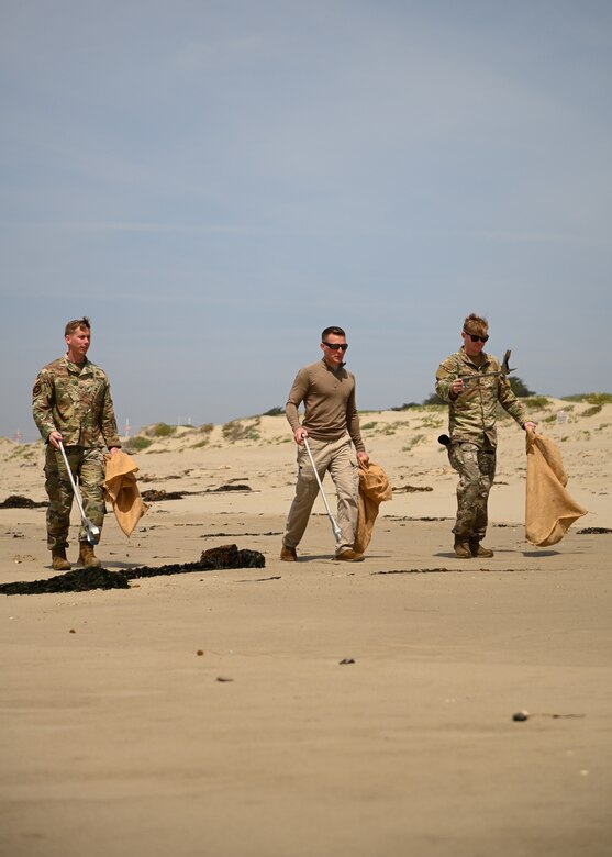 Volunteers help clean up Surf Beach located on Vandenberg Space Force Base, Calif., on April 27, 2022. Once a quarter, volunteers gather at a beach on base and clean up litter to protect the environment. (U.S. Space Force photo by Airman 1st Class Kadielle Shaw)