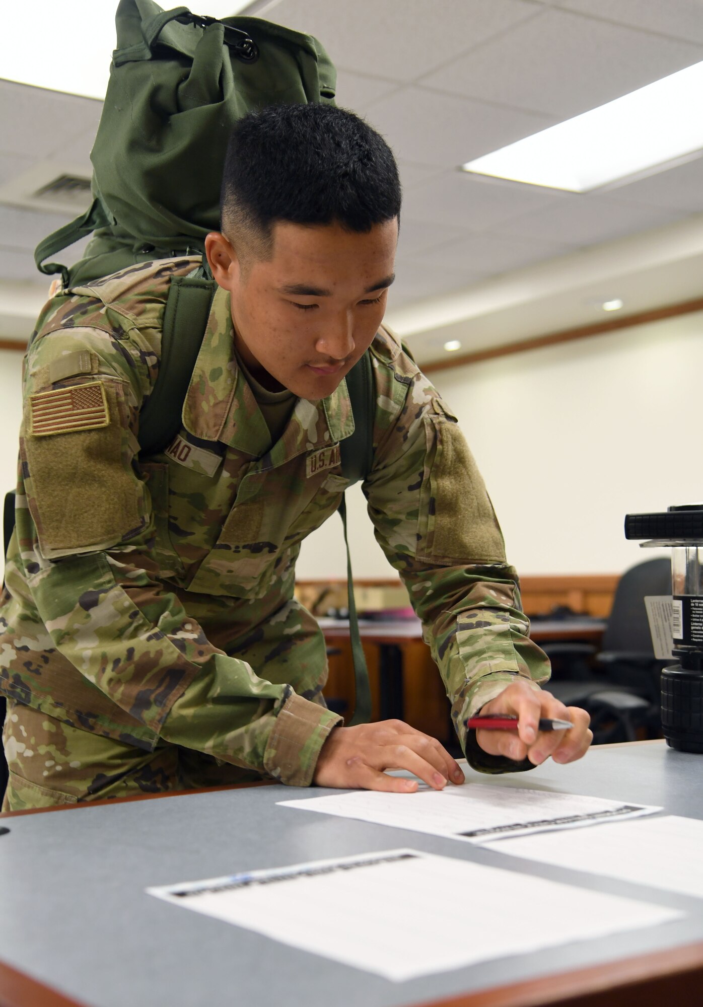 U.S. Air Force Airman Bunao Trey, 335th Training Squadron student, in-processes into Allee Hall for sheltering during a hurricane exercise at Keesler Air Force Base, Mississippi, April 29, 2022. Keesler personnel participate in exercise scenarios in preparation for hurricane season. (U.S. Air Force photo by Kemberly Groue)