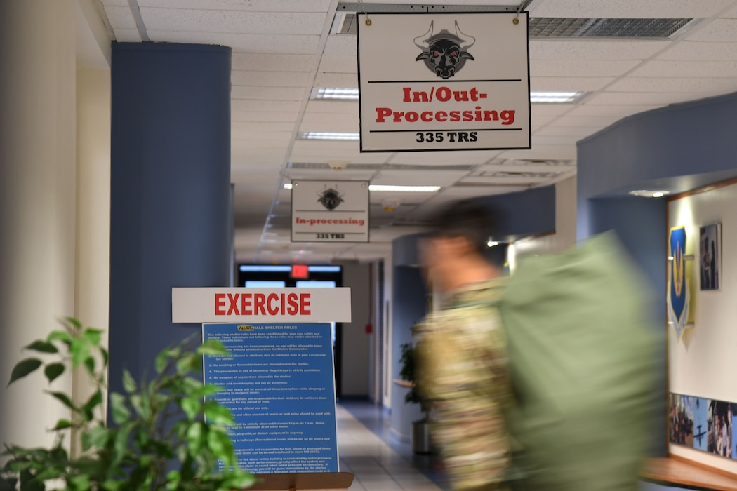 An Airman from the 81st Training Group in-processes into the Allee Hall shelter during a hurricane exercise at Keesler Air Force Base, Mississippi, April 29, 2022. Keesler personnel participate in exercise scenarios in preparation for hurricane season. (U.S. Air Force photo by Kemberly Groue)