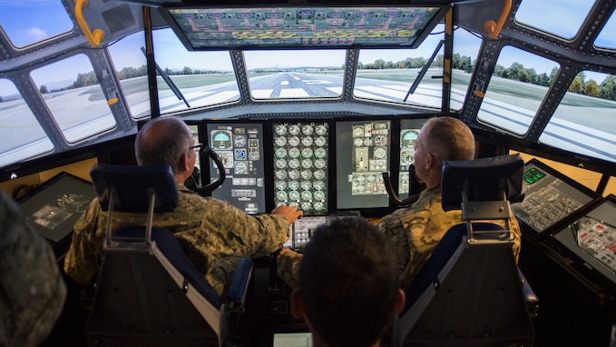 Col. Hugo Parentini, Uruguayan Air Force, and Col. Stephen Gwinn, 103rd Airlift Wing Commander, operate the wing’s C-130H Hercules Multi-Misson Crew Trainer (MMCT) during a State Partnership Program visit to Bradley Air National Guard Base, East Granby, Conn. Aug. 15, 2019. Connecticut and Uruguay are celebrating 20 years of partnership through SPP, a nationwide program the National Guard established in 1993 to promote enduring and mutually beneficial security relationships with ally nations. (U.S. Air National Guard photo by Staff Sgt. Steven Tucker)