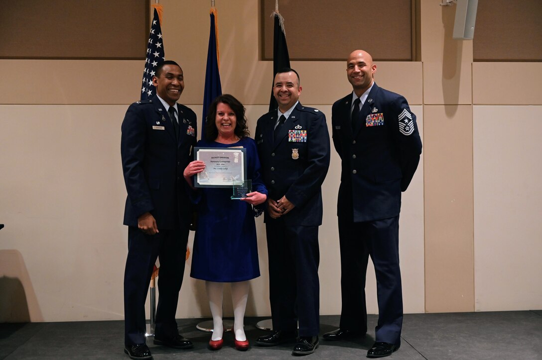 Col. Marcus Jackson, Buckley Garrison commander, welcomes Cindy Colip,  the director of Public Works, City of Aurora, as a newly inducted member of the Honorary Commander’s Program at Buckley Space Force Base, Colo., March 16, 2022.