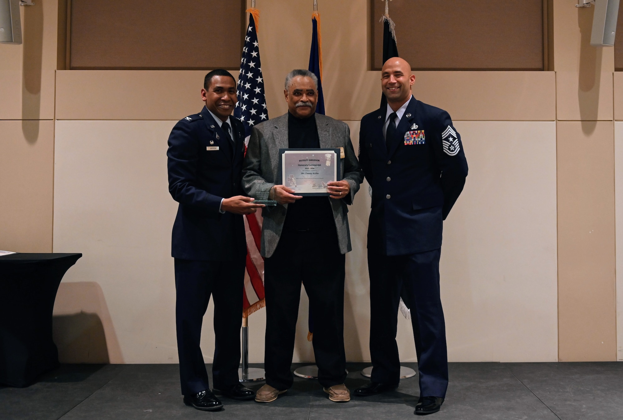 Col. Marcus Jackson, Buckley Garrison commander, welcomes Dewey Hicks, Hubert “Hooks” L. Jones Chapter, Tuskegee Inc., as a newly inducted member of the Honorary Commander’s Program at Buckley Space Force Base, Colo., March 16, 2022.