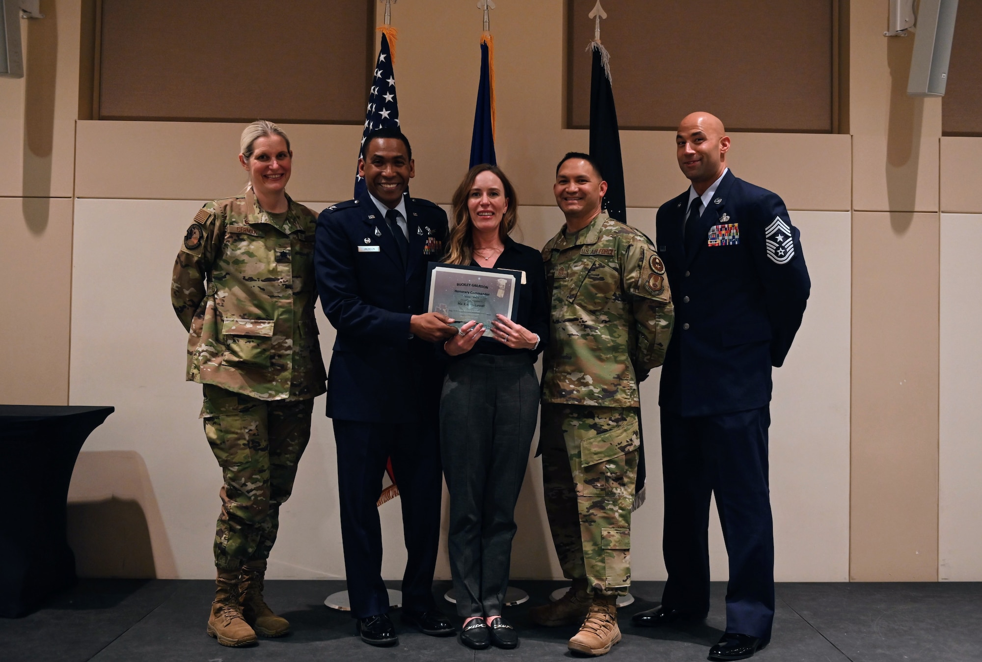 Col. Marcus Jackson, Buckley Garrison commander, welcomes Karen Lovett, Vice President of Operations, UC Health, as a newly inducted member of the Honorary Commander’s Program at Buckley Space Force Base, Colo., March 16, 2022.