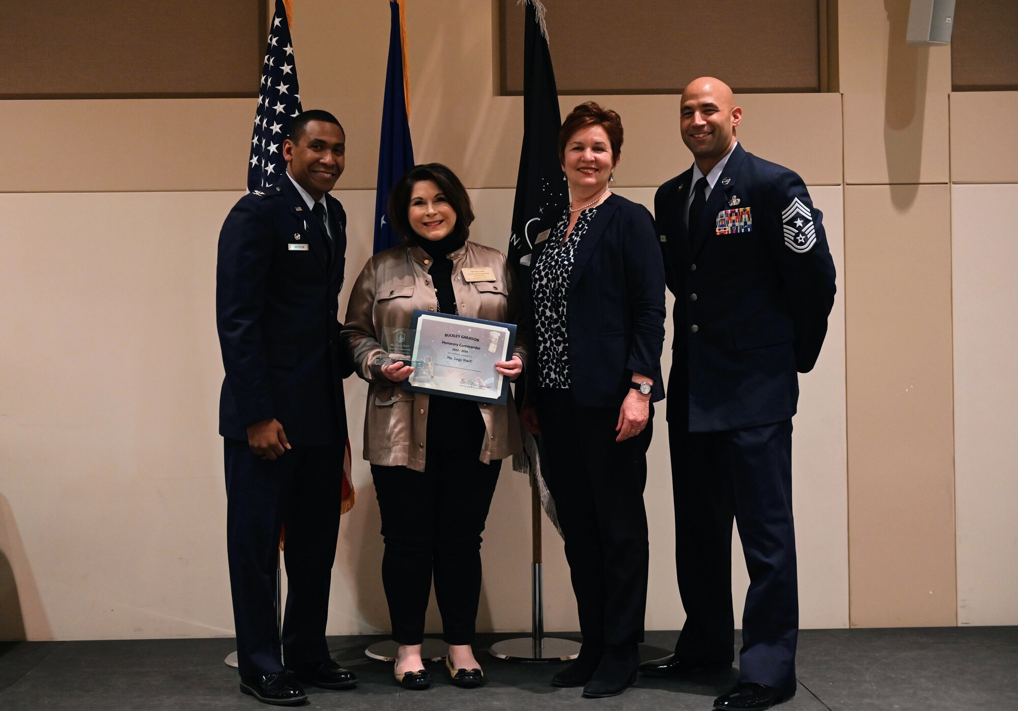 Col. Marcus Jackson, Buckley Garrison commander, welcomes Suzy Hart, the Gaylord Rockies Resort and Convention Center general manager, as a newly inducted member of the Honorary Commander’s Program at Buckley Space Force Base, Colo., March 16, 2022.