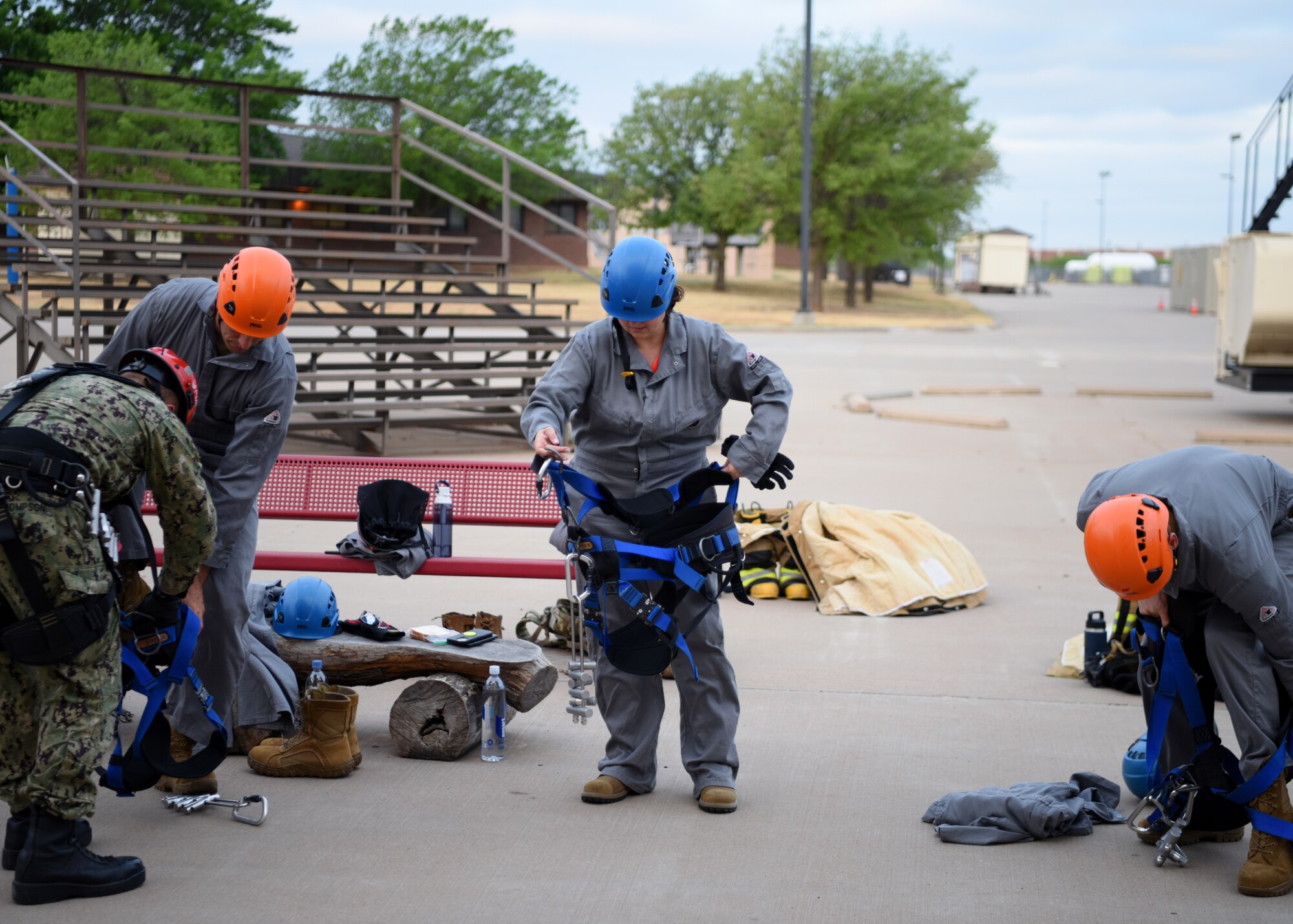 U.S. Air Force Col. Angelina Maguinness, 17th Training Group commander, suits up to repel from a building at the Louis F. Garland Department of Defense Fire Academy, Goodfellow Air Force Base, Texas, April 20, 2022. Instructors led each marshal through tasks their firefighters had gone through for training. The Fire Marshal course was designed to provide insight on the numerous responsibilities and challenges within Department of Defense Fire and Emergency Services to future  civil engineer commanders. (U.S. Air Force photo by Senior Airman Ethan Sherwood)