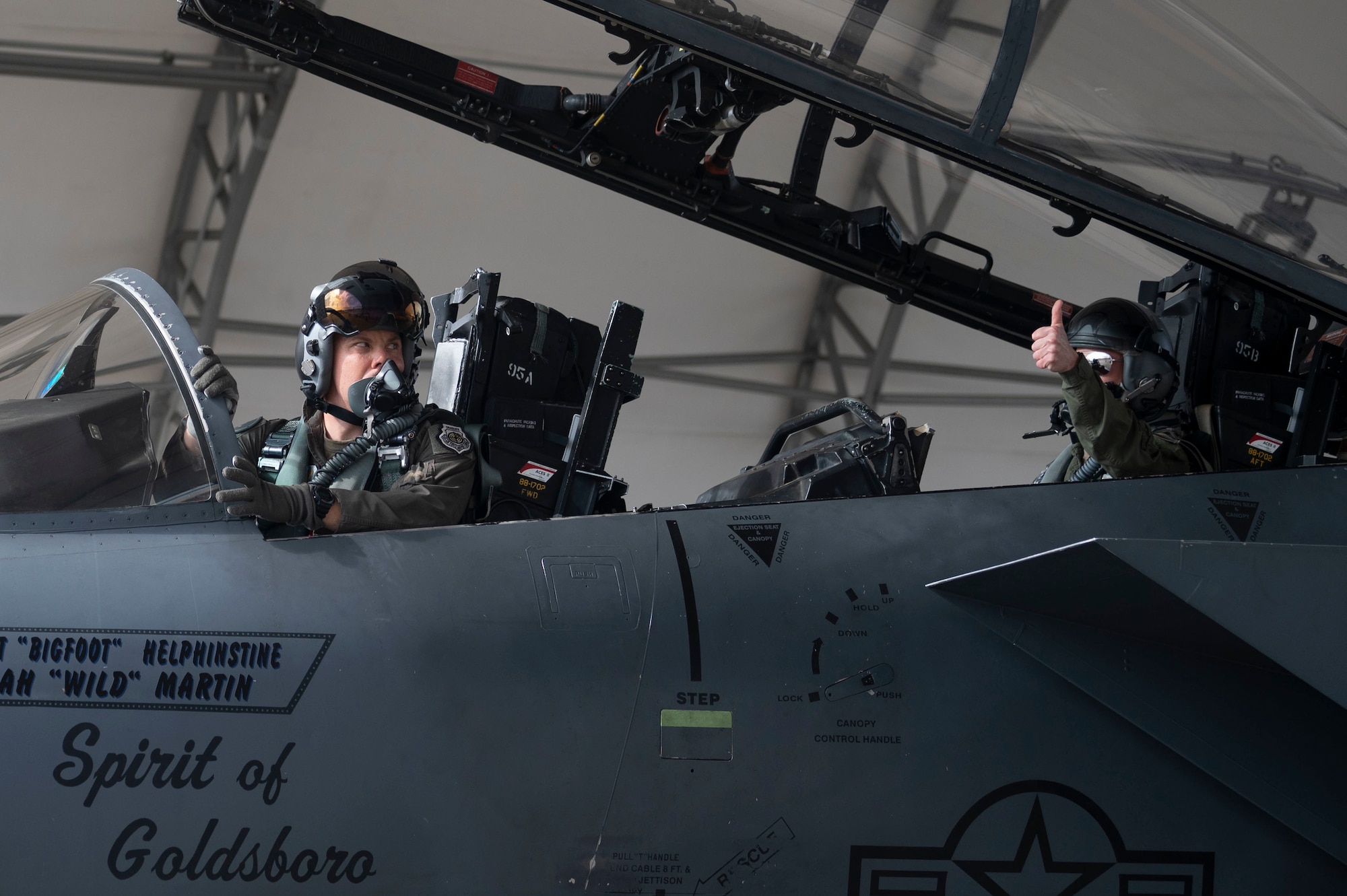 Col. Kurt Helphinstine, 4th Fighter Wing commander, and SrA Garret Ford, 704th Aircraft Maintenance Squadron crew chief, prepare to take off at Seymour Johnson Air Force Base, North Carolina, May 2, 2022. Col. Helphinstine took his final flight as the commander of the 4th FW. (U.S. Air Force photo by Senior Airman Kevin Holloway)