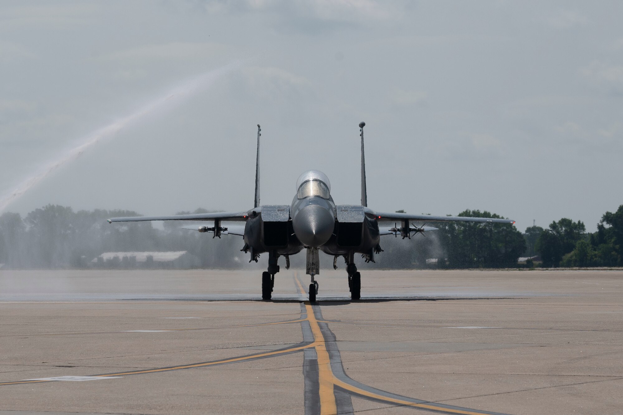 Col. Kurt Helphinstine, taxis under an arch of water as part of a traditional water salute after completing his final flight at Seymour Johnson Air Force Base, North Carolina, May 2, 2022. This was Helphinstine’s final flight before leaving the 4th FW. (U.S. Air Force photo by Senior Airman Kevin Holloway)