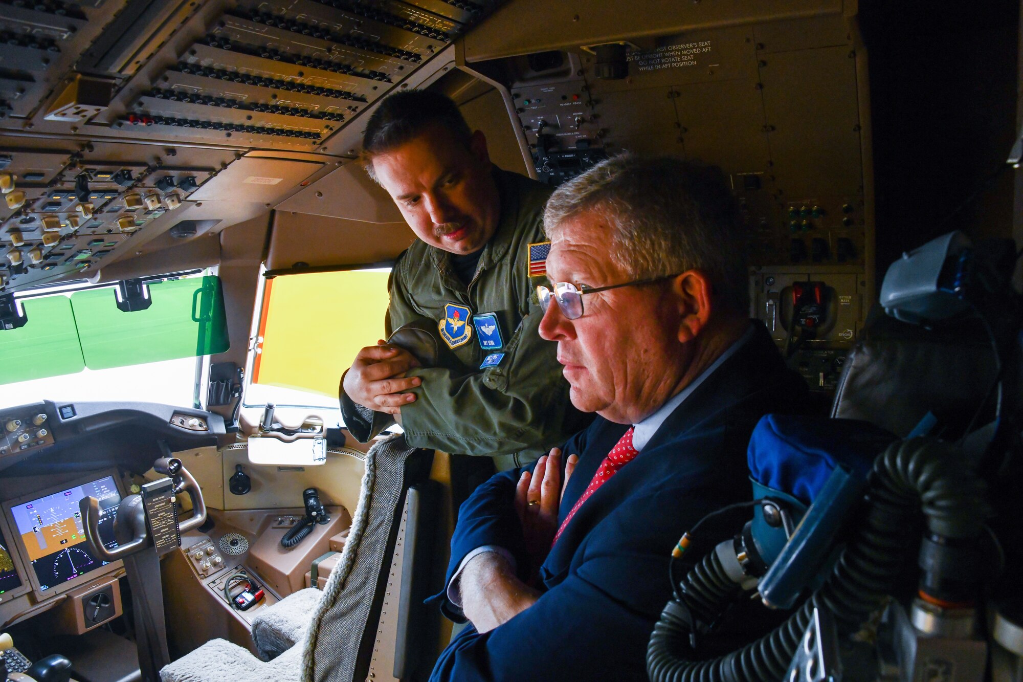 U.S. Air Force Maj. Gary Sowa, 56th Air Refueling Squadron operations flight chief, briefs Rep. Frank Lucas, Oklahoma congressman, on the capabilities of the KC-46A Pegasus at Altus Air Force Base (AAFB), Oklahoma, April 22, 2022. The KC-46 is one of two aerial refueling aircraft at Altus AFB. (U.S. Air Force photo by Airman 1st Class Miyah Gray)