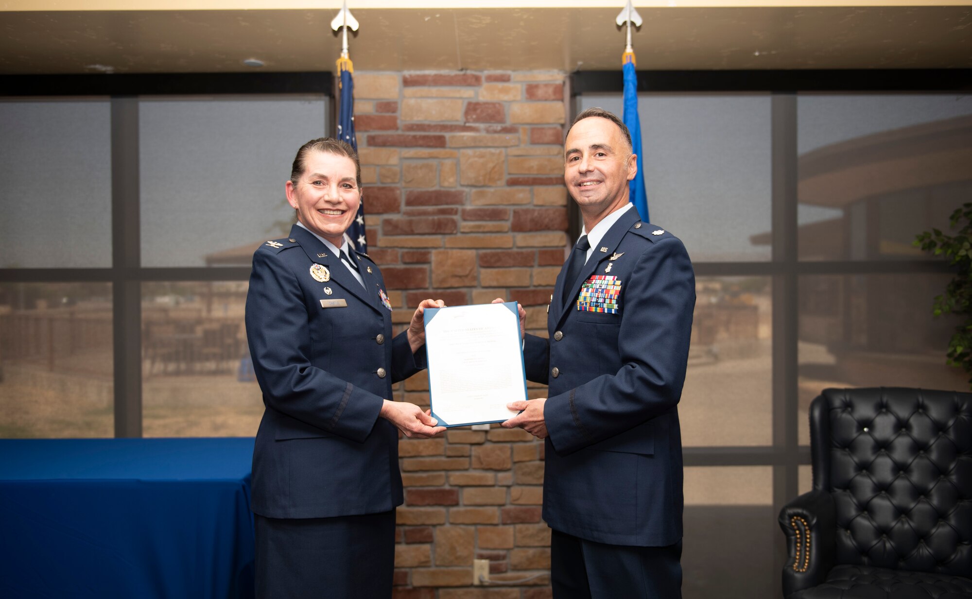 Col. Valerie Castle, 49th Medical Group commander, presents the Meritorious Service Medal to Lt. Col. Jack Vilardi, former 49th Medical Support Squadron commander, during the 49th MDSS inactivation ceremony in Club Holloman, April 29, 2022, on Holloman Air Force Base, New Mexico.