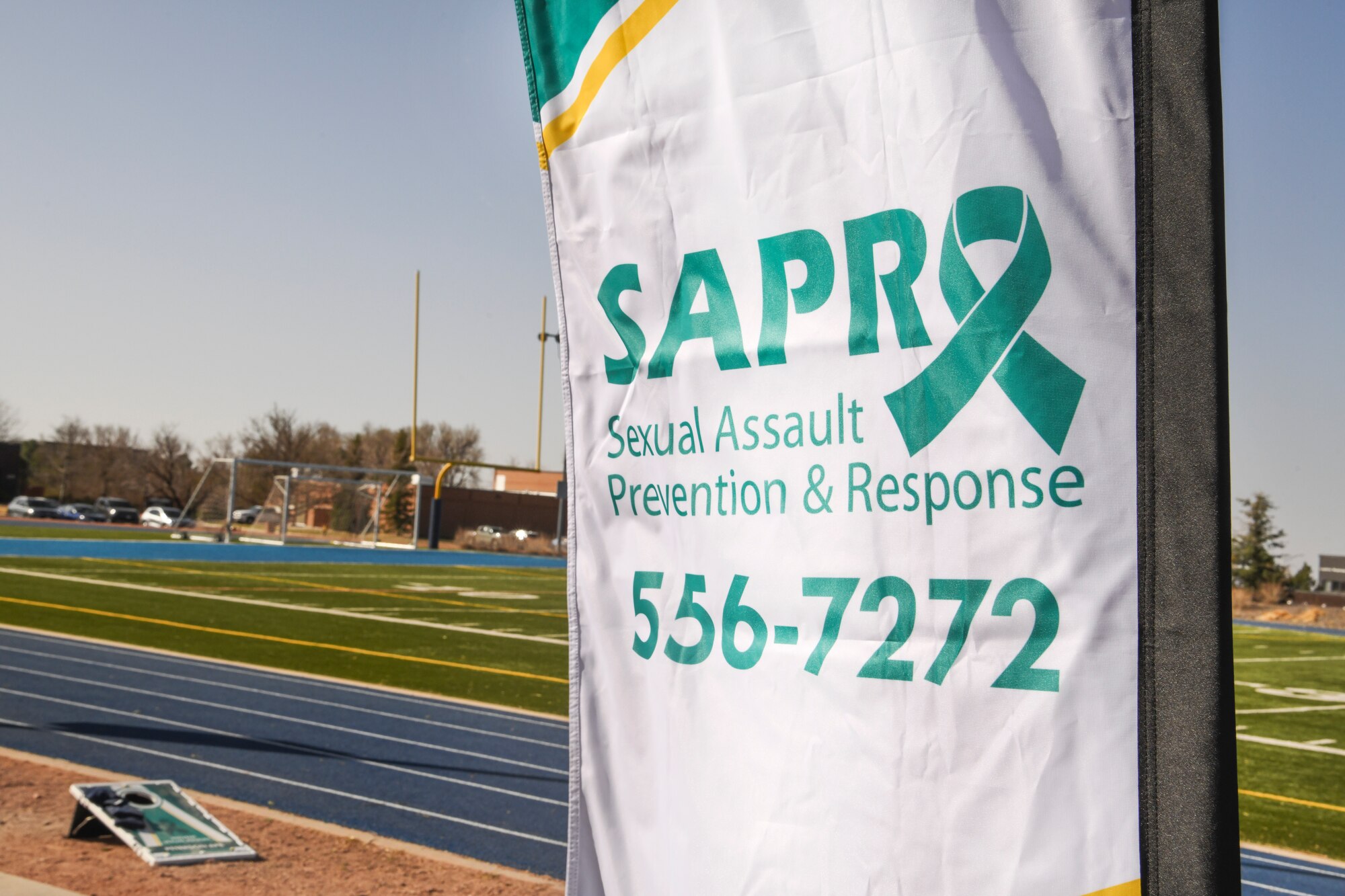 Sexual Assault Prevention and Response flag with phone number 556-7272