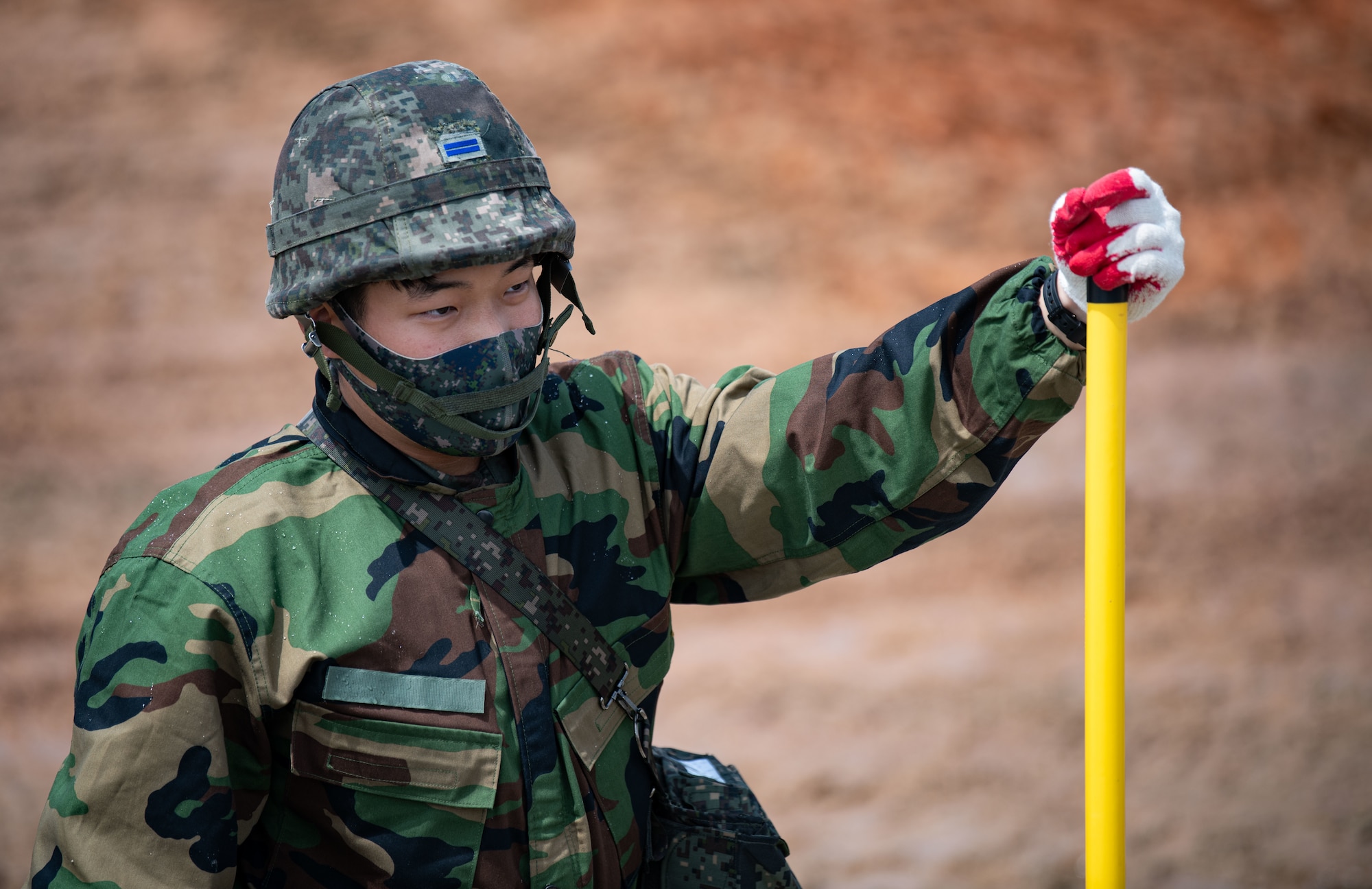 Republic of Korea and U.S. Air Force members fill a simulated crater with water and concrete during Rapid Airfield Damage Repair (RADR) training at Kunsan Air Base, ROK, April 26, 2022.
