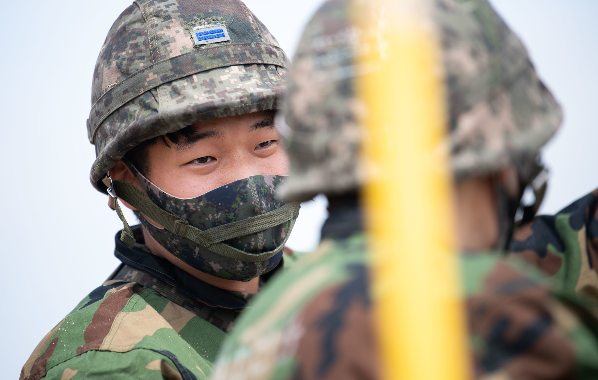 Republic of Korea and U.S. Air Force members fill a simulated crater with water and concrete during Rapid Airfield Damage Repair (RADR) training at Kunsan Air Base, ROK, April 26, 2022.
