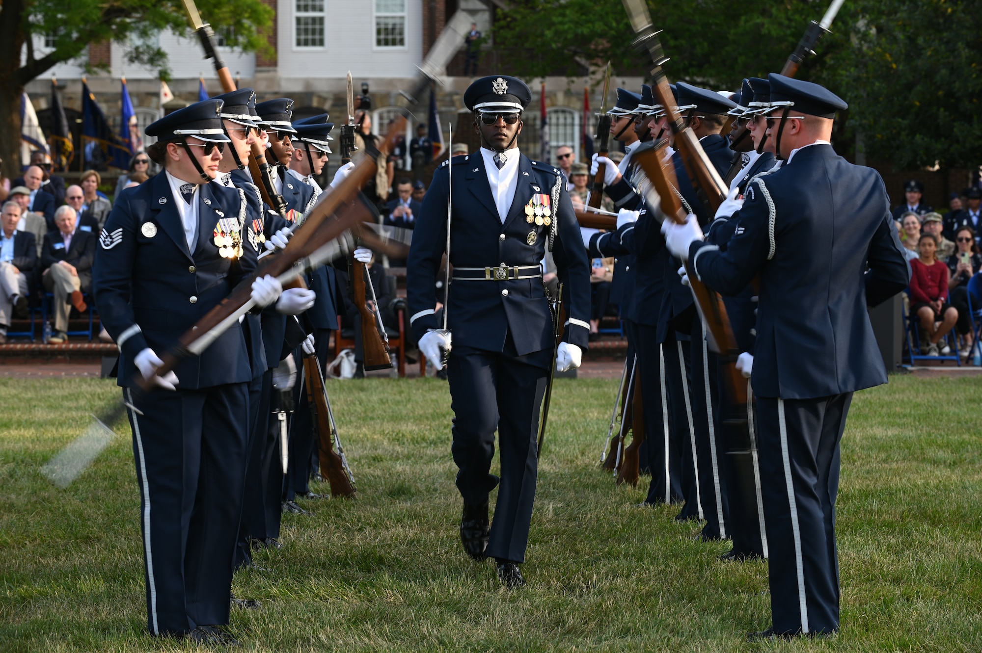 Airmen of the U.S. Air Force Honor Guard demonstrate military bearing and precision in a performance at the U.S. Air Force Spring Tattoo May 3, 2022, on the Air Force Ceremonial Lawn on Joint Base Anacostia-Bolling, Washington D.C. The mission of the Air Force Honor Guard is to represent all Airmen in the U.S. Air Force by demonstrating military excellence, precision and discipline while inspiring patriotism in audiences worldwide. (U.S. Air Force photo by Airman 1st Class Anna Smith)