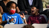 Two children enjoy the music of the United States Air Force Band while attending the U.S. Air Force Spring Tattoo to celebrate the service’s 75th Birthday on Joint Base Anacostia-Bolling, Washington, D.C. May 3, 2022. The historic, multi-demonstration event of military pomp and ceremony was hosted by the Air Force Chief of Staff Gen. CQ Brown, Jr. and Chief Master Sgt. of the Air Force JoAnne S. Bass. The key features of the Tattoo include performances by The United States Air Force Band and U.S. Air Force Honor Guard. The members of the Band and Honor Guard share a common mission of representing the values the Air Force and helping to foster a community across our nation and with our international allies.  (U.S. Air Force photo by Staff Sgt. Stuart Bright)