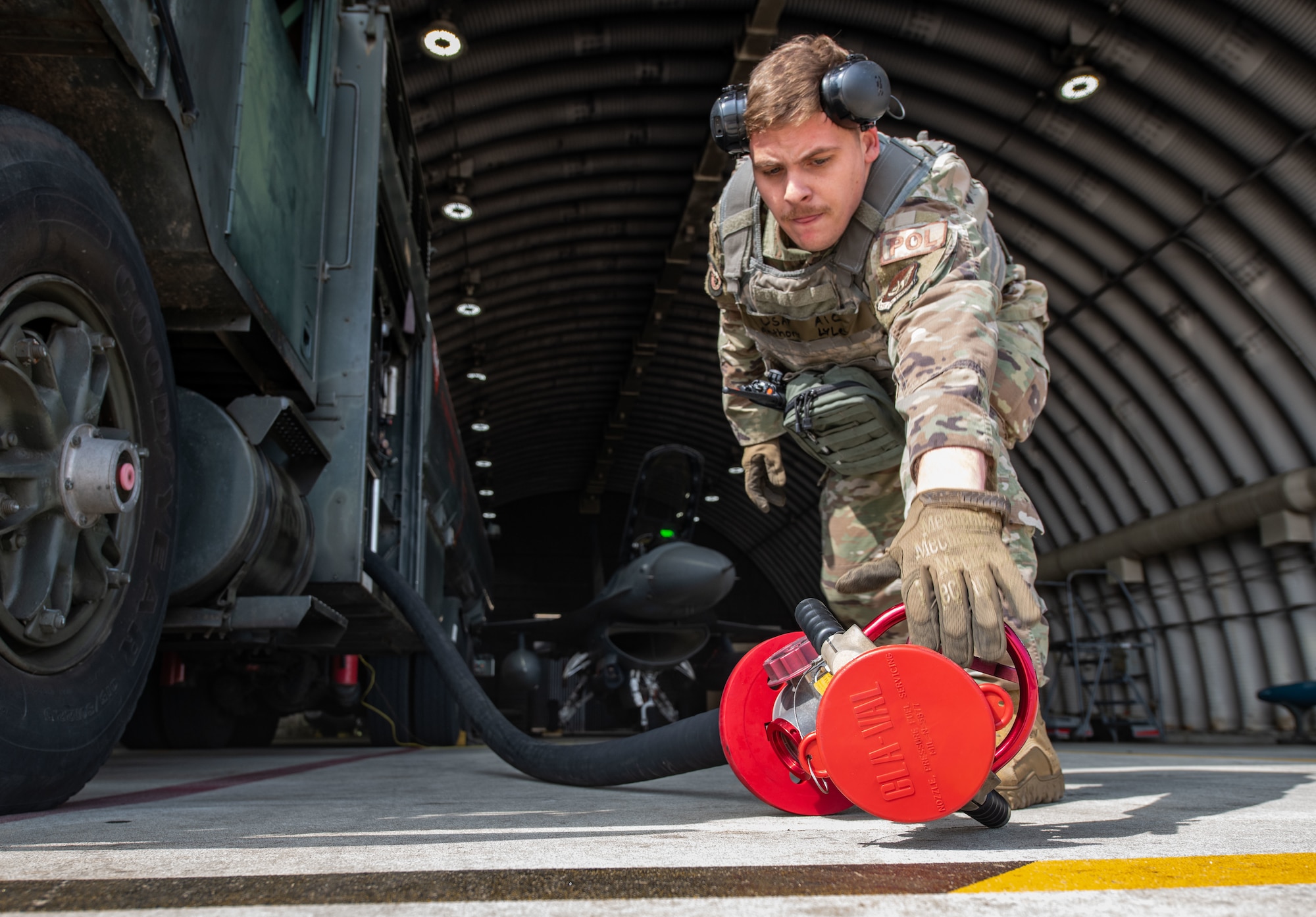 Airman 1st Class Anthony Lyles, 8th Logistics Readiness Squadron fuels distribution operator, stows a fuel hose at Kunsan Air Base, Republic of Korea, April 28, 2022. Fuels distribution is one facet of many the Airmen of the 8th LRS petroleum, oil and lubricants flight (POL) is responsible for. To ensure the Wolf Pack’s fuels supply is ready for use, it must be quality controlled in the fuel laboratory, which ensures the fuel being used hasn’t been contaminated.  (U.S. Air Force photo by Staff Sgt. Gabrielle Spalding)