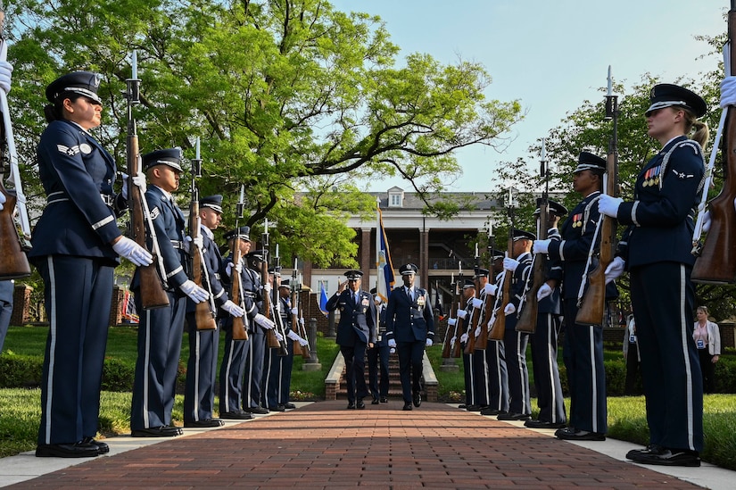 Members of the U.S. Air Force Honor Guard Drill Team greet U.S. Air Force Chief of Staff Gen. CQ Brown, Jr., at the start of the U.S. Air Force’s 75th Birthday Celebration Spring Tattoo on the Air Force Ceremonial Lawn at Joint Base Anacostia-Bolling, Washington, D.C., May 3, 2022. The key features of the Tattoo included performances by The United States Air Force Band and U.S. Air Force Honor Guard. The members of the Band and Honor Guard share a common mission of representing Air Force values and helping to foster a community across our nation and with our international allies.  (U.S. Air Force photo by Airman Bill Guilliam)