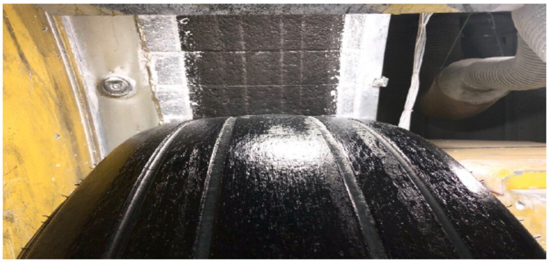 Close up on tire inside internal drum dynamometer