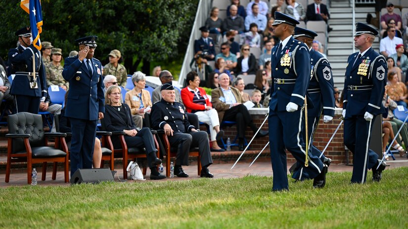Airmen perform for a crowd.