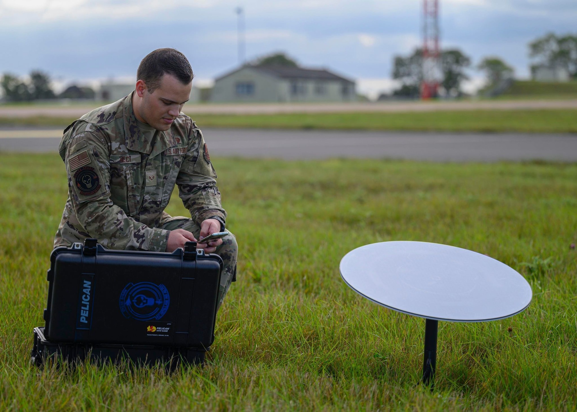 Senior Airman Jordan Heck, 7th Communications Squadron client systems apprentice, establishes GO-Comm connectivity with SpaceX’s Starlink service on Royal Air Force Fairford, United Kingdom, in October 2021. SrA Heck developed the portable communications kit, leveraging only $3,000 of squadron innovation funds to build two kits. (U.S. Air Force photo by Airman 1st Class Josiah Brown)