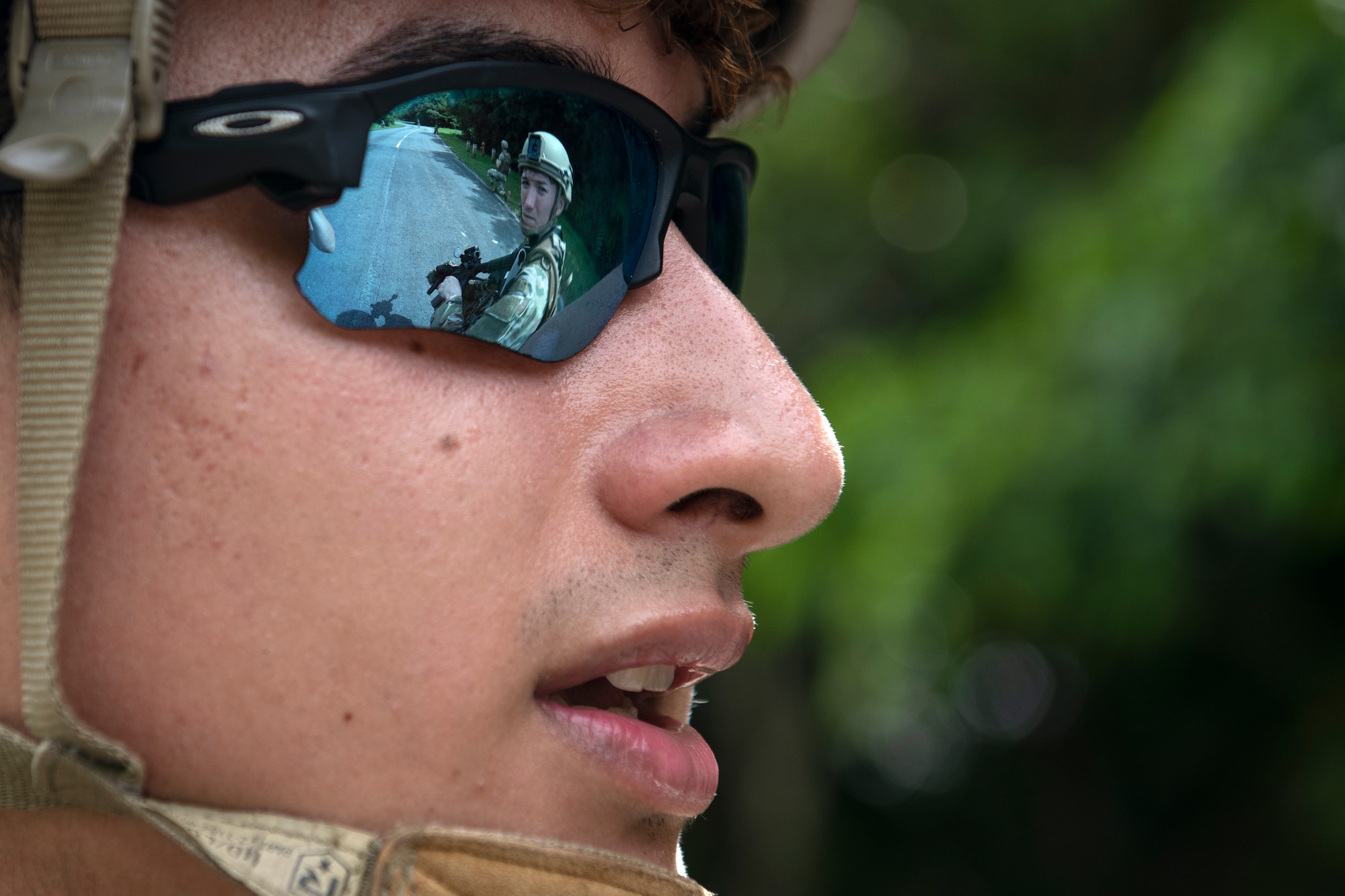 U.S. Air Force Airmen assigned to the 18th Security Forces Squadron discuss reconnaissance during a field training exercise at Kadena Air Base, Japan, April 27, 2022. The training is an annual requirement for all SFS members, covering traveling techniques, movement formations, and utilizing cover and concealment to advance on or defend objectives. (U.S. Air Force photo by Senior Airman Jessi Monte)