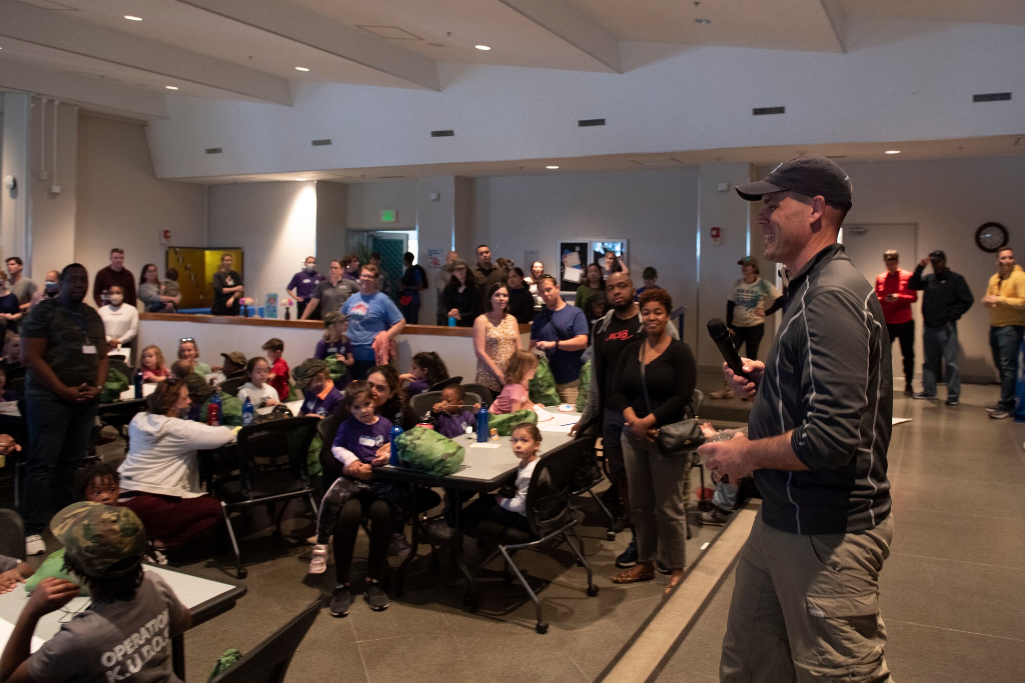 Col. Andrew Campbell, 374th Airlift Wing commander, provides closing remarks during Operation Kids Understanding Deployment Operations at Yokota Air Base, Japan, April 30, 2022. Campbell thanked everyone for their participation and hoped that the children gained an understanding of a deployment setting. (U.S. Air Force photo by Tech. Sgt. Joshua Edwards)