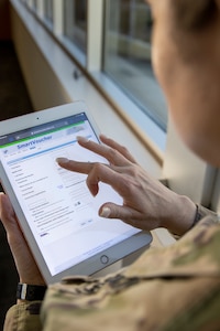 Sgt. Maj. Julie Harris, U.S. Army Financial Management Command operations senior enlisted advisor, uses a table device with her myPay pin and password to access the Defense Finance and Accounting Service’s SmartVoucher at the Maj. Gen. Emmett J. Bean Federal Center March 9, 2022. In August 2022, DFAS will add responsive design to SmartVoucher, which will make it even easier to use on personal devices. (U.S. Army photo by Mark R. W. Orders-Woempner)