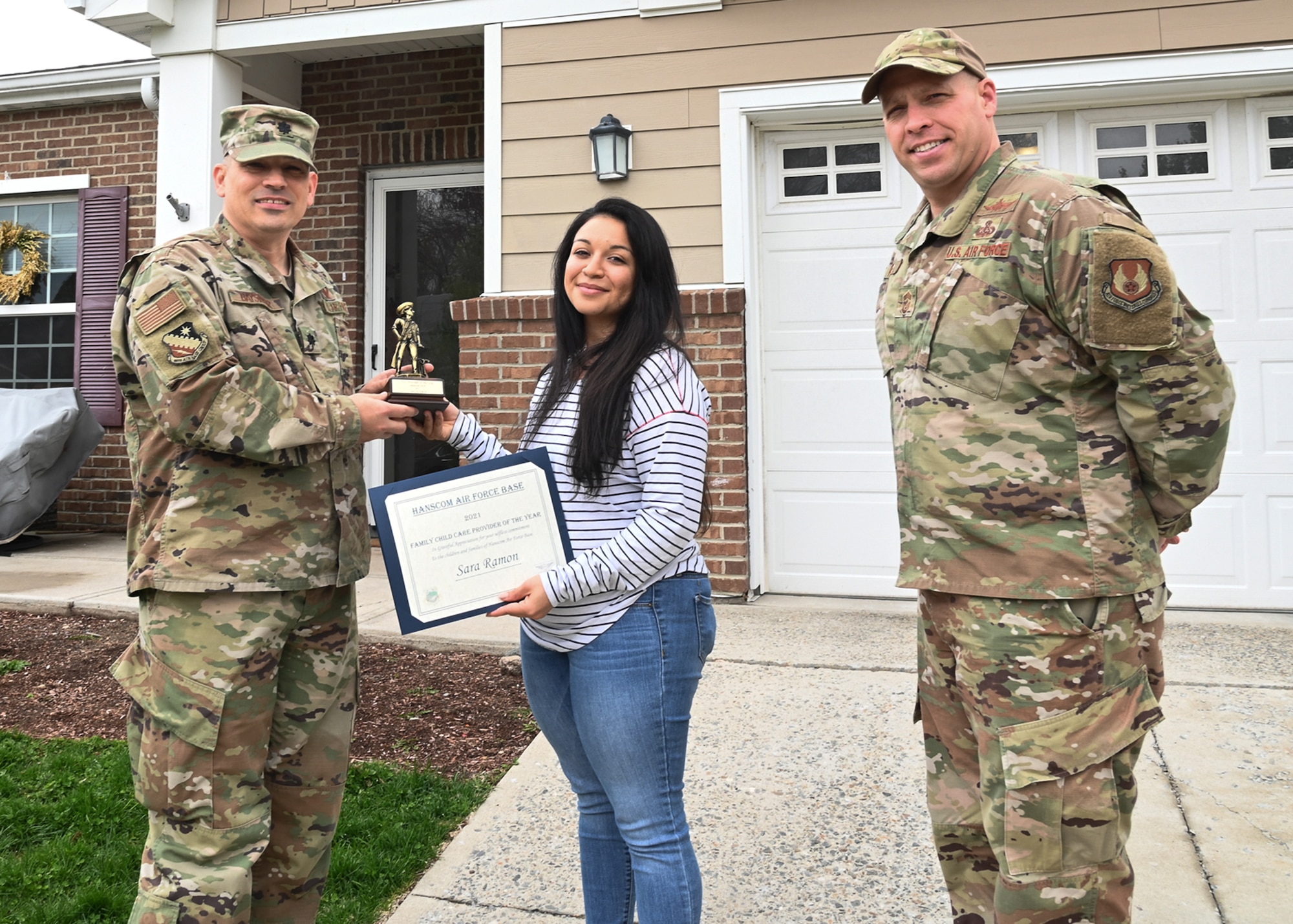 leaders present certificate; outside base housing;