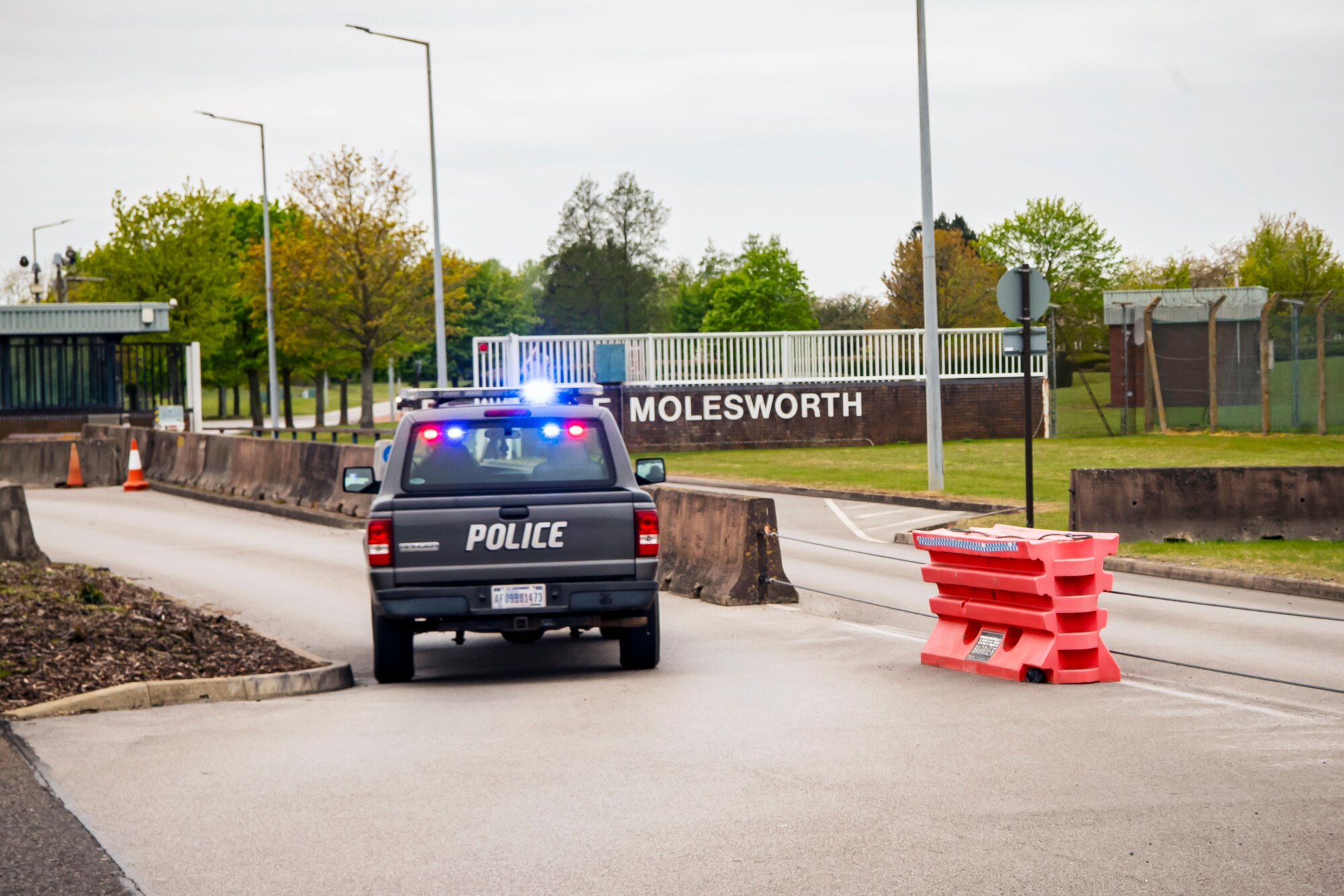 A patrol vehicle from the 423d Security Forces Squadron pursues a gate runner during a field training exercise at RAF Molesworth, England, April 27, 2022. The exercise was designed to evaluate the strengths and weaknesses of 423d SFS members' response to various scenarios including domestic disturbances, drunk driving and other base security incidents. (U.S. Air Force photo by Staff Sgt. Eugene Oliver)