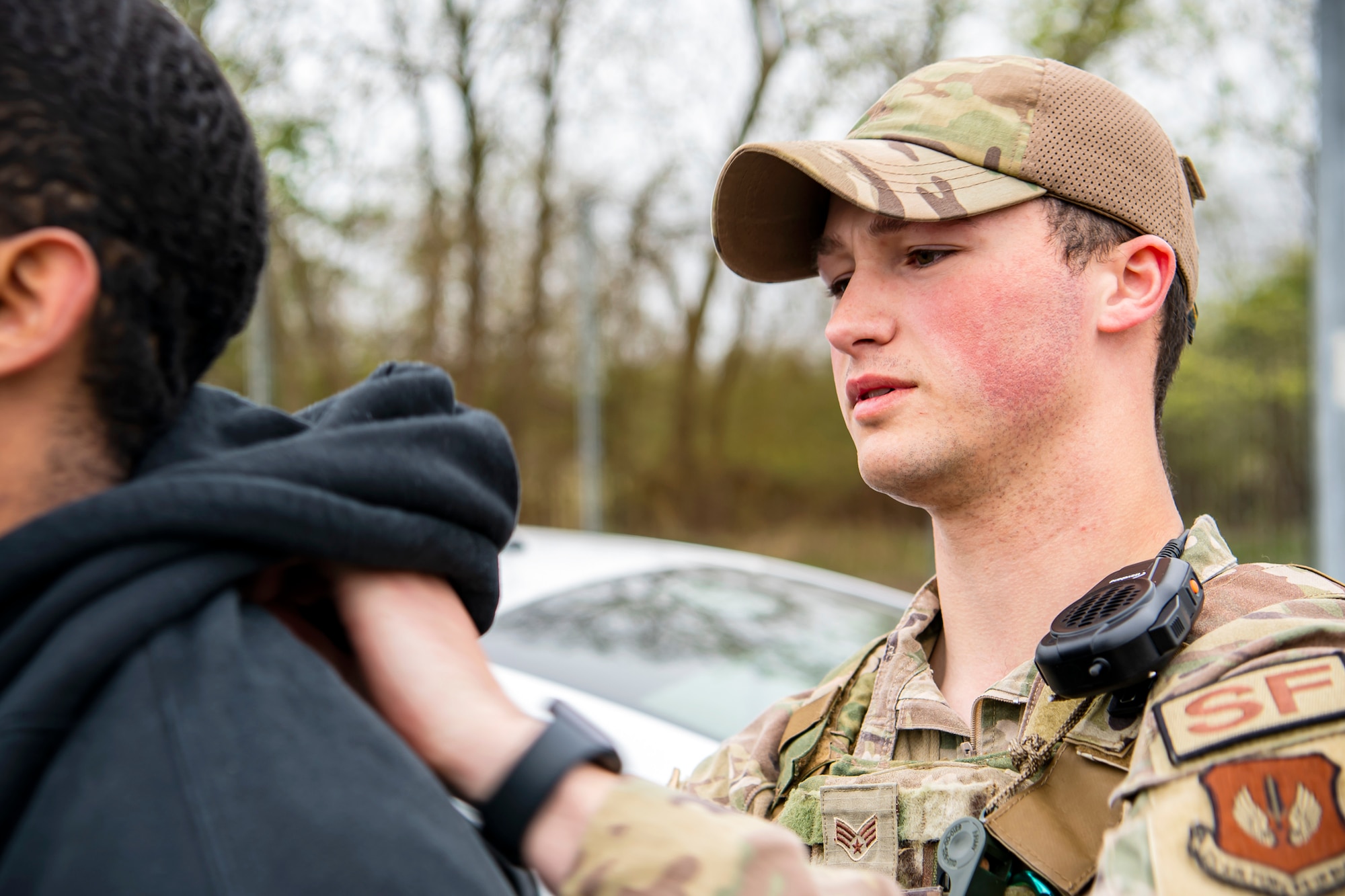 U.S. Air Force Senior Airman Zachary Hairston, 423d Security Forces Squadron patrolman, searches a simulated suspect as part of a field training exercise at RAF Molesworth, England, April 27, 2022. The exercise was designed to evaluate the strengths and weaknesses of 423d SFS members' response to various scenarios including domestic disturbances, drunk driving and other base security incidents. (U.S. Air Force photo by Staff Sgt. Eugene Oliver)