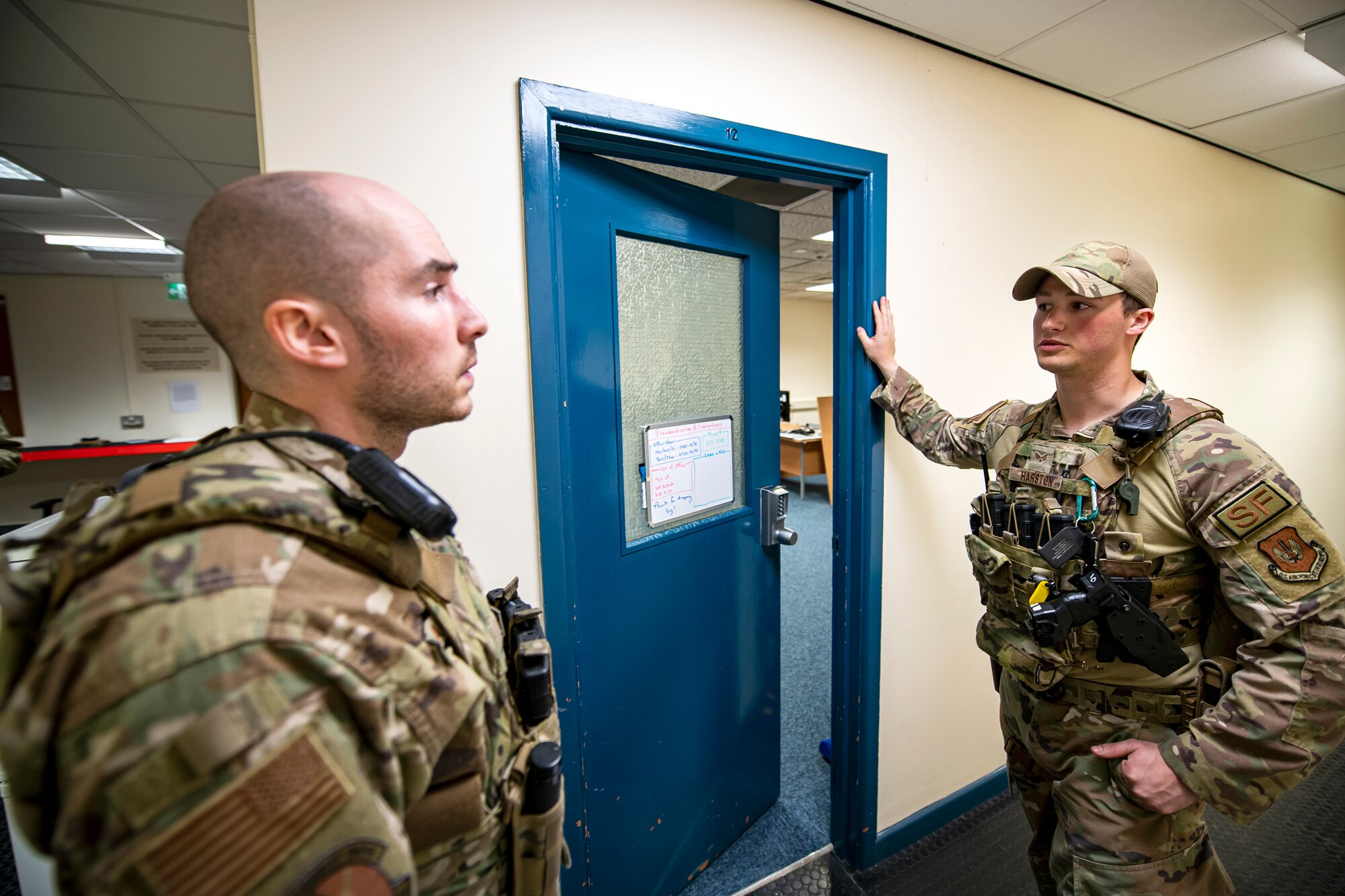 U.S. Air Force Senior Airman Zachary Hairston, right, 423d Security Forces Squadron patrolman, speaks with Staff Sgt. Elijah Allen, 423d Security Forces Squadron flight sergeant, during a field training exercise at RAF Molesworth, England, April 27, 2022. The exercise was designed to evaluate the strengths and weaknesses of 423d SFS members' response to various scenarios including domestic disturbances, drunk driving and other base security incidents. (U.S. Air Force photo by Staff Sgt. Eugene Oliver)