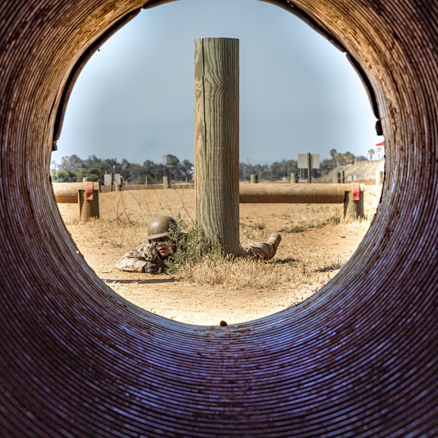 A U.S. Marine Corps officer candidate with Officer Selection Team San Diego, buddy rushes during an Officer Candidates School preparation weekend at Edson Range, Camp Pendleton, California on April 30, 2022. The OCS preparation weekend is designed to prepare aspiring Marine Corps officers mentally and physically for the rigors of OCS. (U.S. Marine Corps photo by Staff Sgt. Kelsey Dornfeld)