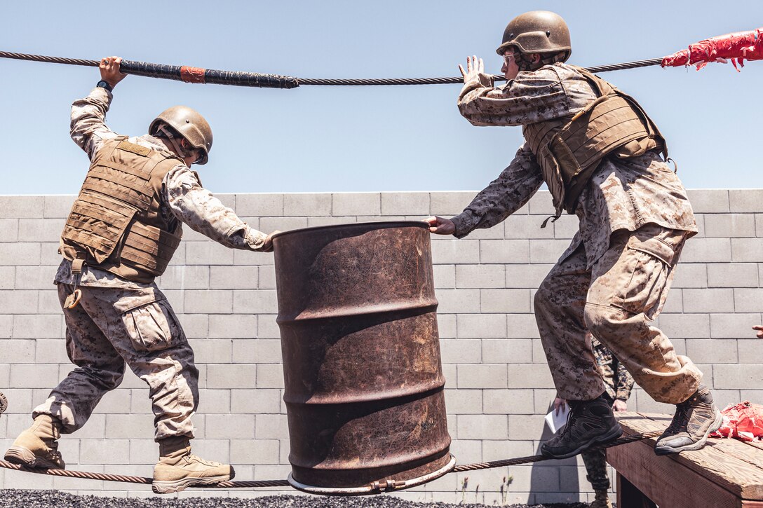 U.S. Marine Corps officer candidates with Officer Selection Team San Diego, work through a scenario during the leadership reaction course at an Officer Candidates School preparation weekend, Camp Pendleton, California on April 30, 2022. The OCS preparation weekend is designed to prepare aspiring Marine Corps officers mentally and physically for the rigors of OCS. (U.S. Marine Corps photo by Staff Sgt. Kelsey Dornfeld)