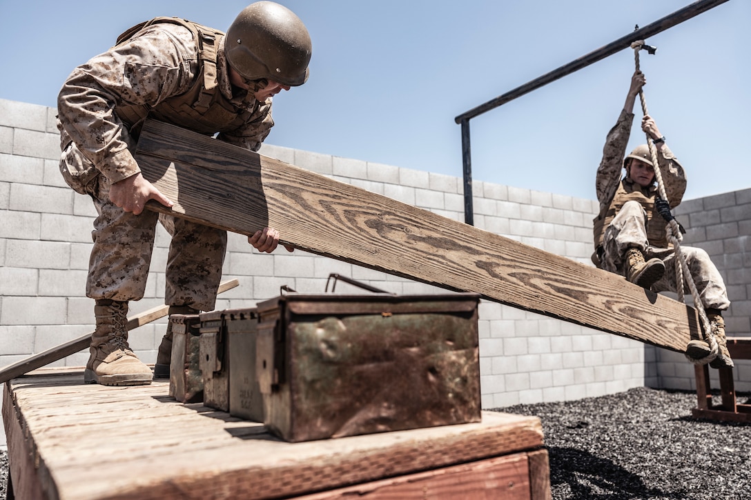 U.S. Marine Corps officer candidates with Officer Selection Team San Diego, work through a scenario during the leadership reaction course at an Officer Candidates School preparation weekend, Camp Pendleton, California on April 30, 2022. The OCS preparation weekend is designed to prepare aspiring Marine Corps officers mentally and physically for the rigors of OCS. (U.S. Marine Corps photo by Staff Sgt. Kelsey Dornfeld)