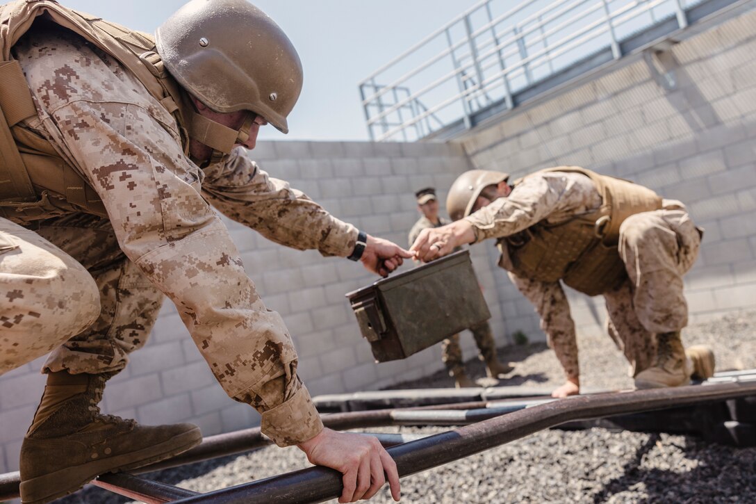 U.S. Marine Corps officer candidates with Officer Selection Team San Diego, work through a scenario during the leadership reaction course at an Officer Candidates School preparation weekend, Camp Pendleton, California on April 30, 2022. The OCS preparation weekend is designed to prepare aspiring Marine Corps officers mentally and physically for the rigors of OCS. (U.S. Marine Corps photo by Staff Sgt. Kelsey Dornfeld)