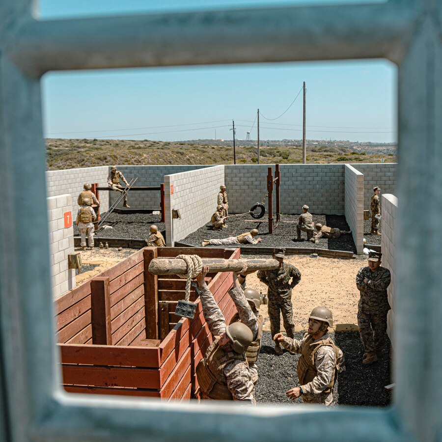U.S. Marine Corps officer candidates with Officer Selection Team San Diego, work through a scenario during the leadership reaction course at an Officer Candidates School preparation weekend, Camp Pendleton, California on April 30, 2022. The OCS preparation weekend is designed to prepare aspiring Marine Corps officers mentally and physically for the rigors of OCS. (U.S. Marine Corps photo by Staff Sgt. Kelsey Dornfeld)