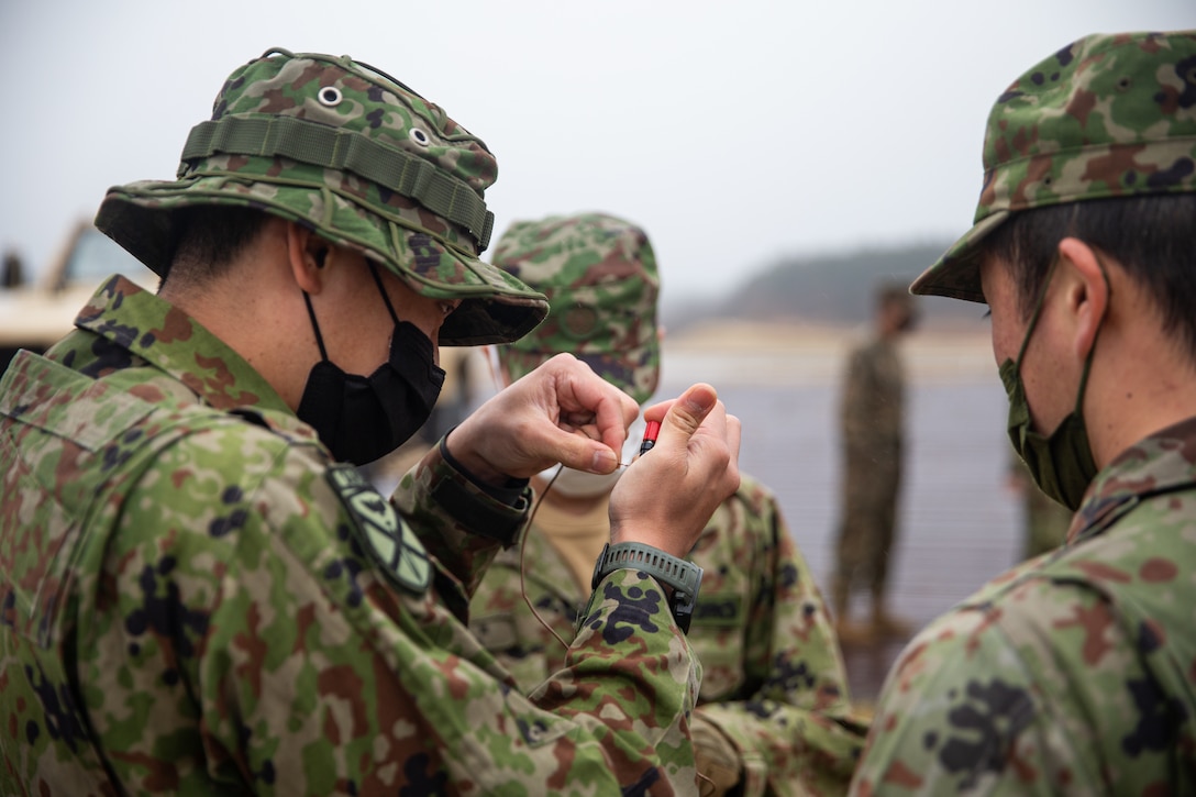 Soldiers with the 1st Amphibious Rapid Deployment Regiment, Japanese Ground Self-Defense Force, create field expedient antennas at Combined Arms Training Center Camp Fuji, Japan, March 19, 2022. 1ARDR soldiers were taught when a field expedient antenna could be used as well as how to build one. Maritime Defense Exercise Amphibious Rapid Deployment Brigade is a bilateral exercise meant to increase interoperability and strengthen ties between U.S. and Japanese forces for the defense of Japan.