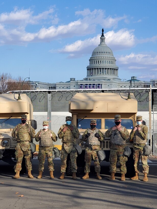 Connecticut Army National Guardsmen assigned to the 141st Medical Company with their M997 ambulances stand in front of the U.S. Capitol Building on January 20, 2021 in Washington D.C. The unit was providing Role I medical care and transportation during the 59th Presidential Inauguration.
