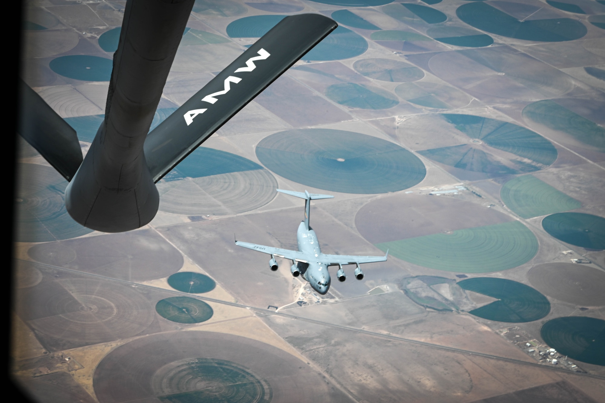 A C-17 Globemaster III departs after receiving air refueling during Task Force Red Mammoth, April 27, 2022. Red Mammoth featured training between all three Altus Air Force Base, Oklahoma, aircraft: the C-17, KC-46 Pegasus, and KC-135 Stratotanker. (U.S. Air Force photo by Senior Airman Kayla Christenson)