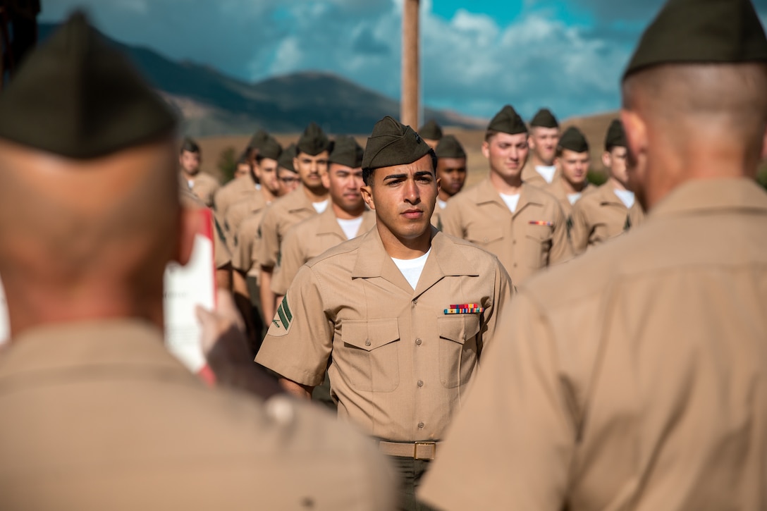 U.S. Marine Cpl.Brunacini, a rifleman with Echo Company, 2nd Battalion, 5th Marine Regiment, 1st Marine Division, stands at attention during his award ceremony at Range 214 on Marine Corps Base Camp Pendleton, California, April 22, 2022. Brunacini, who is currently serving as a block noncommissioned officer with MCB Camp Pendleton’s Range Operations Division, earned a Navy and Marine Corps Commendation Medal for heroic actions taken after he helped save the life of a man wounded in a drive-by shooting in Lemon Grove, California. (U.S. Marine Corps photo by Lance Cpl Hope Straley)