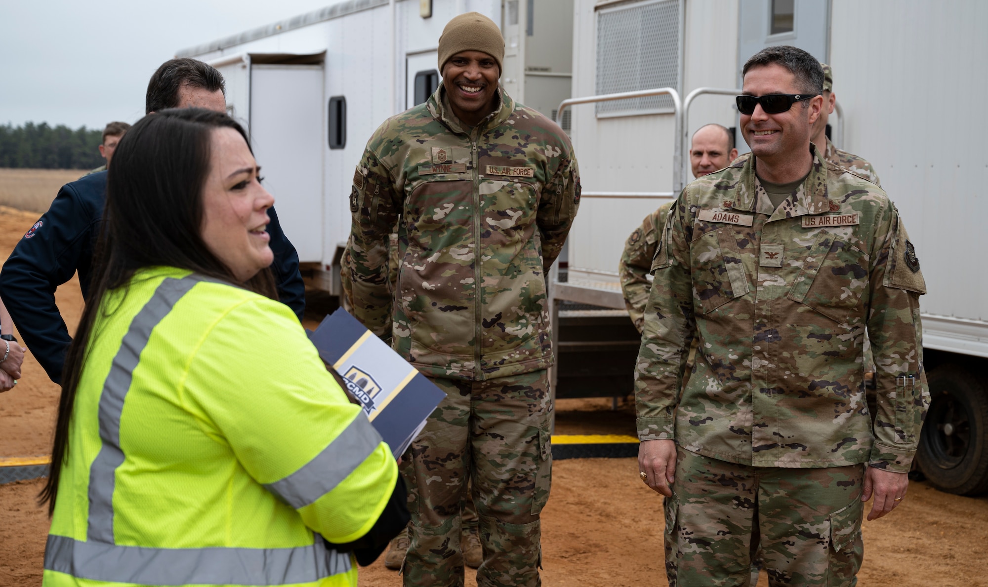 Joint Base McGuire-Dix-Lakehurst leadership is briefed on the process of explosive destruction and assessments during a tour of the destruction site hosted by the Recovered Chemical Materiel Directorate, May 2, 2022, on Joint Base MDL, New Jersey. RCMD partnered with Joint Base MDL for a second mission to destroy World War I-era chemical munitions after discovering a six 75mm projectiles at Joint Base MDL’s Parachute Jump Circle while investigating and removing chemical munitions, munitions of explosive concern and/or munitions constituents from two disposal pits. (U.S. Air Force photo by Staff Sgt. Ariel Owings)