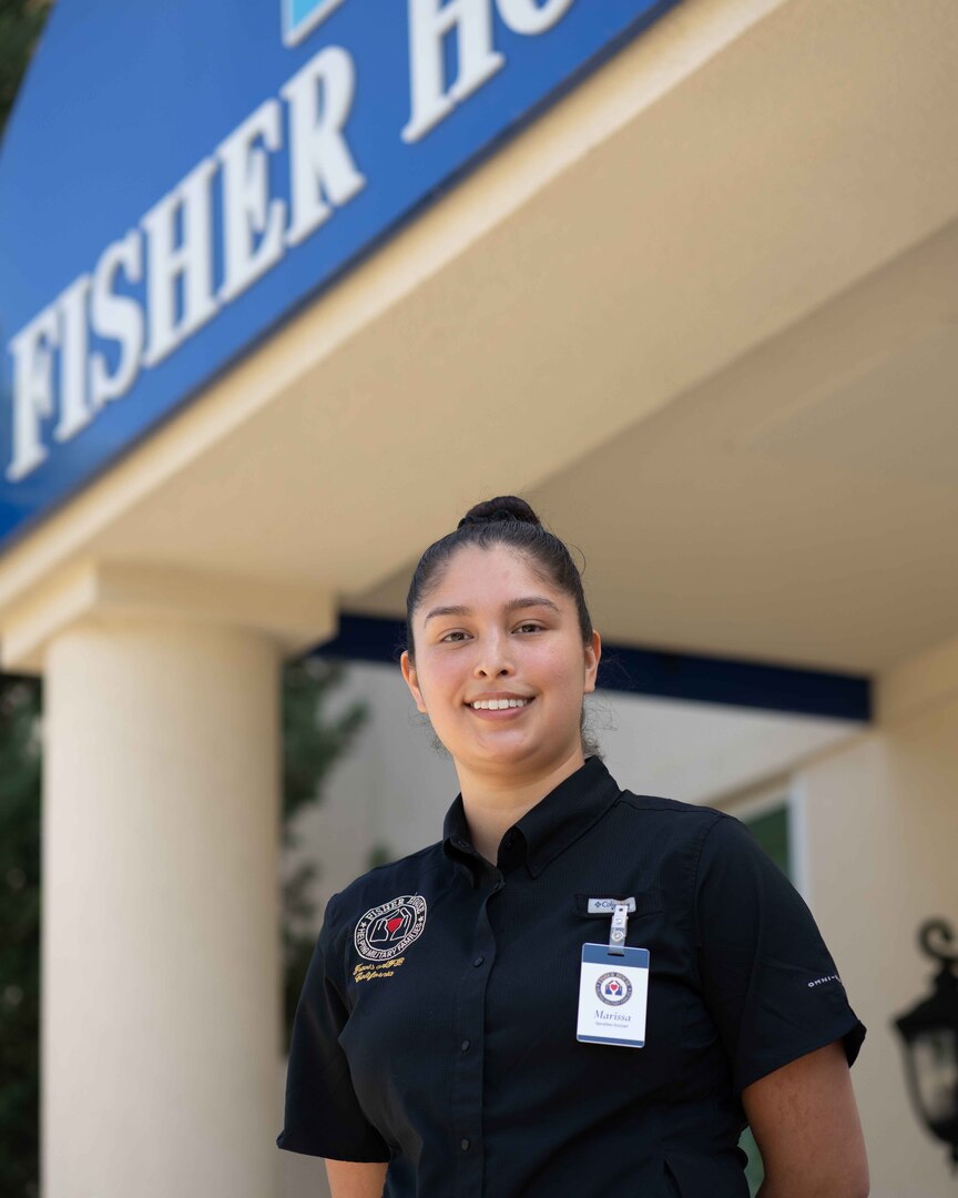 A smiling woman poses for a photo.