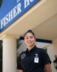 A smiling woman poses for a photo.