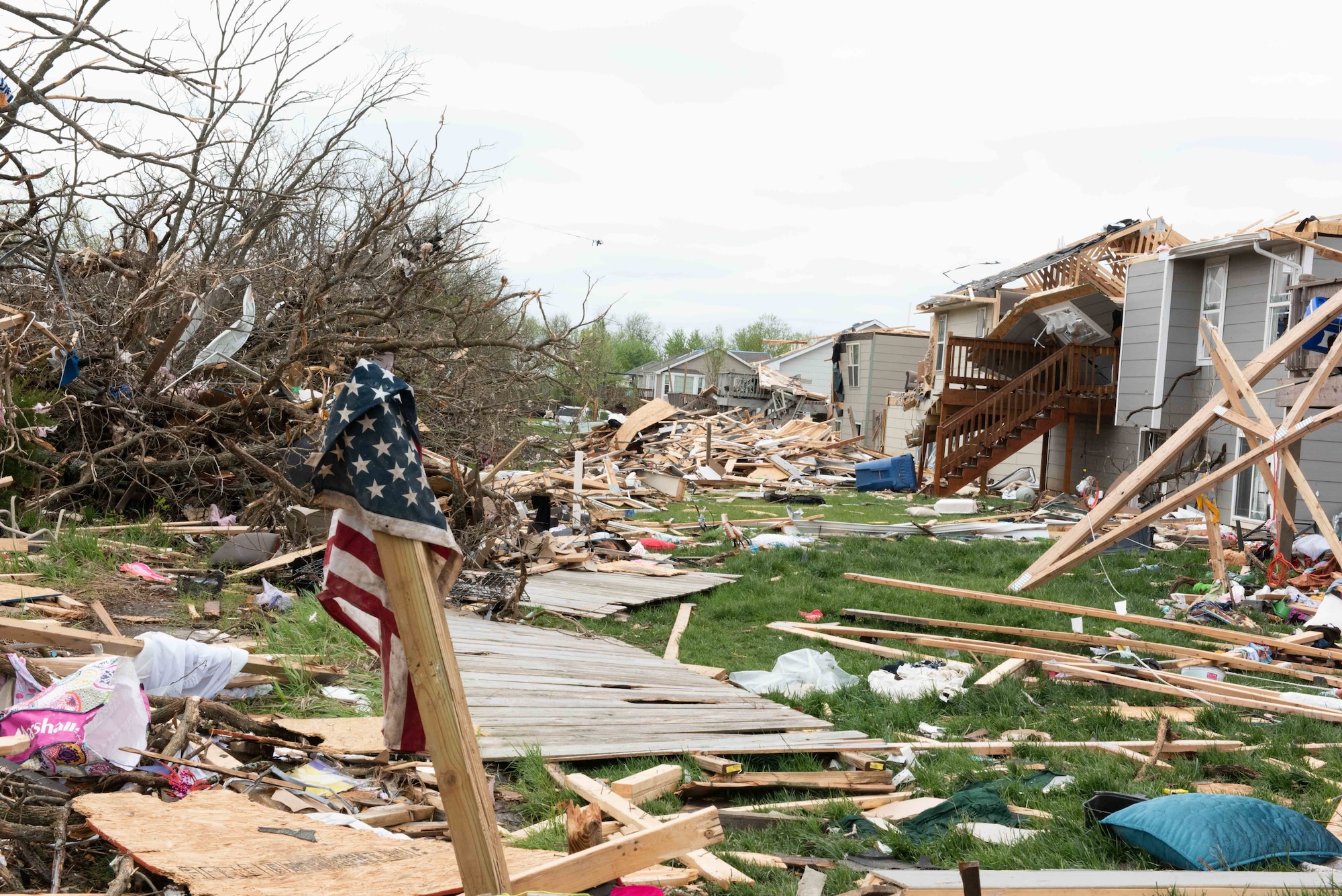 A tattered American Flag hangs on a pole after a recent tornado in Andover, Kansas May 3, 2022.