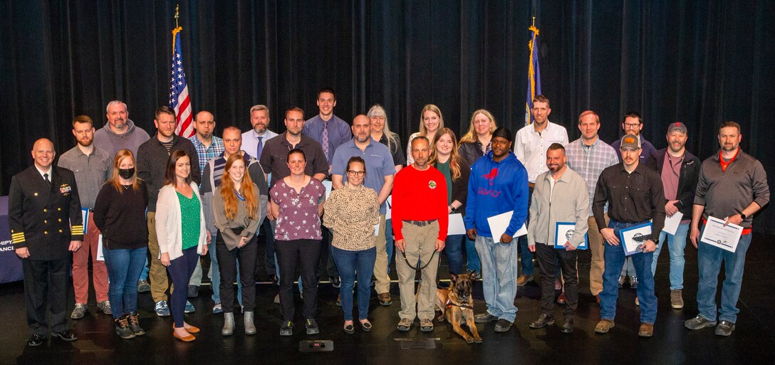 An 2021 Employee of the Year recognition ceremony for Puget Sound Naval Shipyard & Intermediate Maintenance Facility, was held at the Admiral theater in Bremerton, Washington, May 3, 2022. PSNS & IMF Commanding Officer Capt. Jip Mosman,  PSNS & IMF commander, presented the awards. (US Navy photo by Wendy Hallmark)