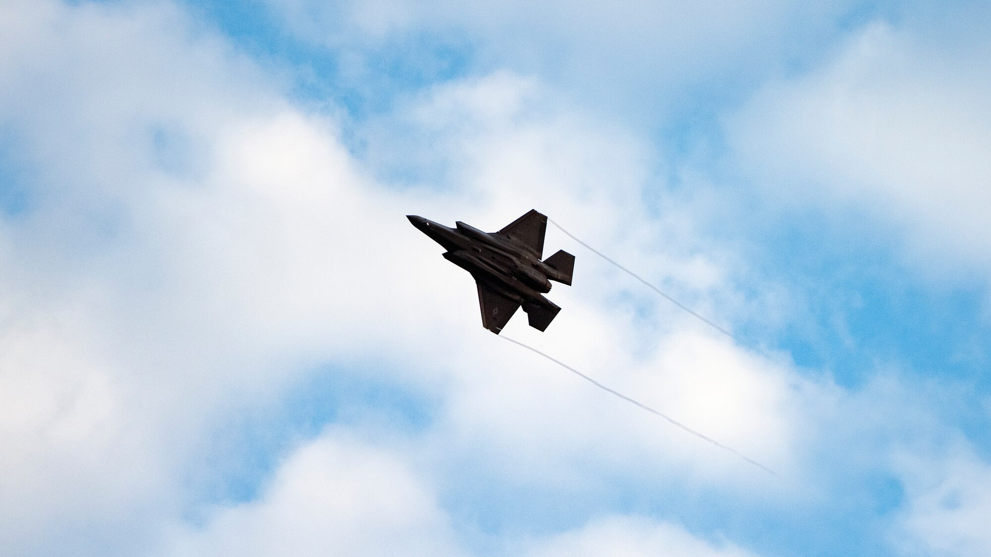 A U.S. Air Force F-35A Lightning II fifth generation fighter aircraft, assigned to the Vermont Air National Guard’s 158th Fighter Wing, flies above Spangdahlem Air Base, Germany, as they prepare to take over for Hill Air Force Base’s 388th Fighter Wing May 02, 2022. U.S. European Command’s ability to rotate between units maintains readiness and morale across the force,  while displaying the U.S. Air Force’s unique ability to integrate seamlessly between Active Duty, Air Force Reserve, and Air National Guard components. (U.S. Air Force photo by Tech. Sgt. Anthony Plyler)
