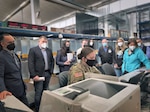 Col. ErvĪns Kopeika and his team from the Latvian State Defense Logistics and Procurement Centre and Keli'i Bright, along with members of his logistics team from the Logistics Readiness Centre-Italy observe a Soldier complete the procedure to check out the issued equipment that is assigned to her name. (Stefanie Mosley, U.S. Army Garrison Italy)