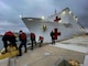 Sailors participate in sea and anchor detail as the Military Sealift Command hospital ship USNS Mercy prepares to depart from Naval Base San Diego marking the beginning of Pacific Partnership 2022.