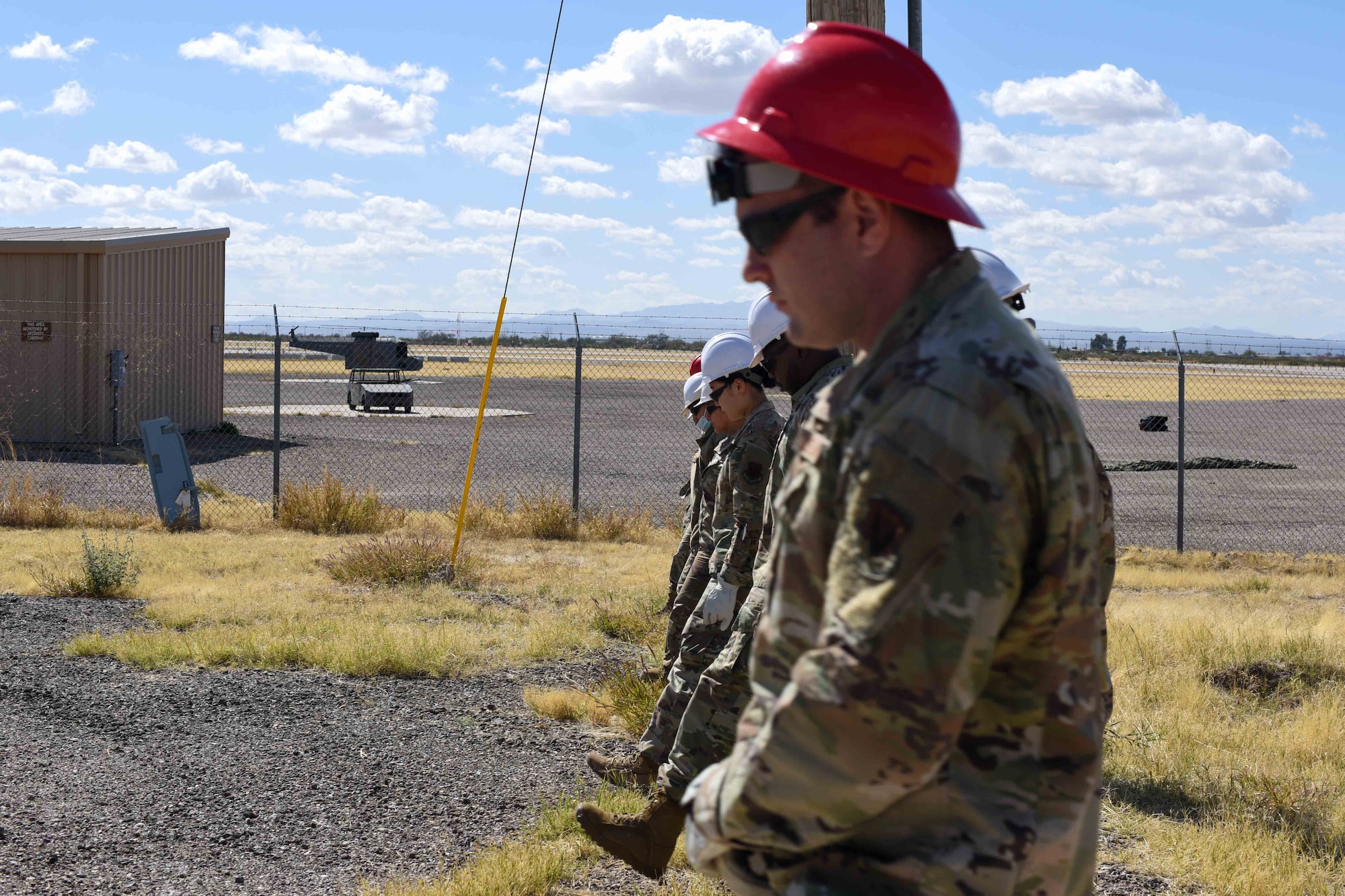 A photo of Airmen walking in a line.