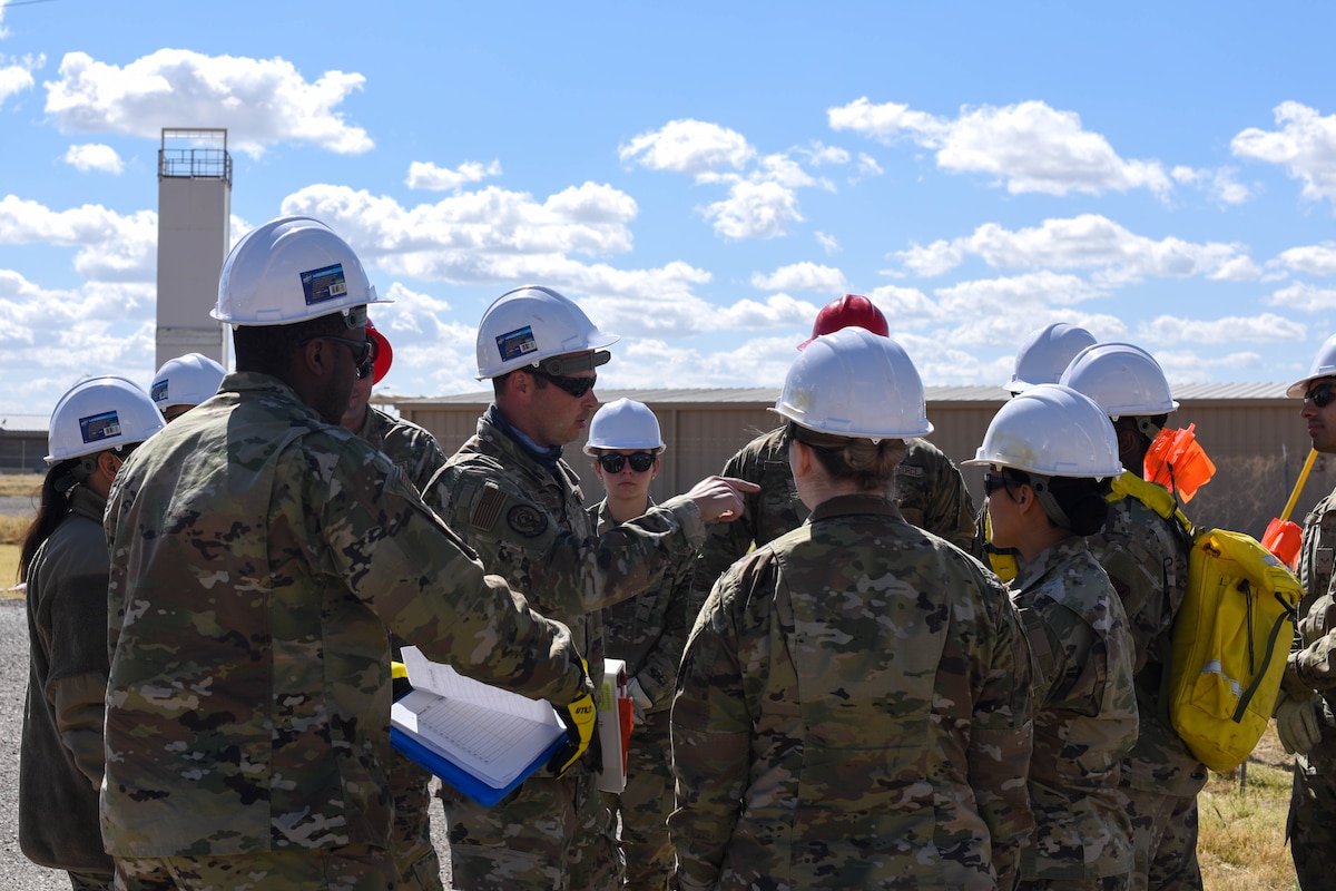 A photo of Airmen in a group having a discussion.