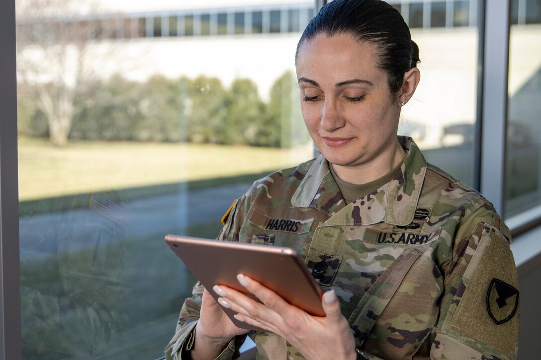 Sgt. Maj. Julie Harris, U.S. Army Financial Management Command operations senior enlisted advisor, uses a table device with her myPay pin and password to access the Defense Finance and Accounting Service’s SmartVoucher at the Maj. Gen. Emmett J. Bean Federal Center March 9, 2022. In August 2022, USAFMCOM’s Army Military Pay Offices are helping deploy DFAS’ SmartVoucher program to automate the Army’s permanent-change-of-station travel voucher claim process. (U.S. Army photo by Mark R. W. Orders-Woempner)